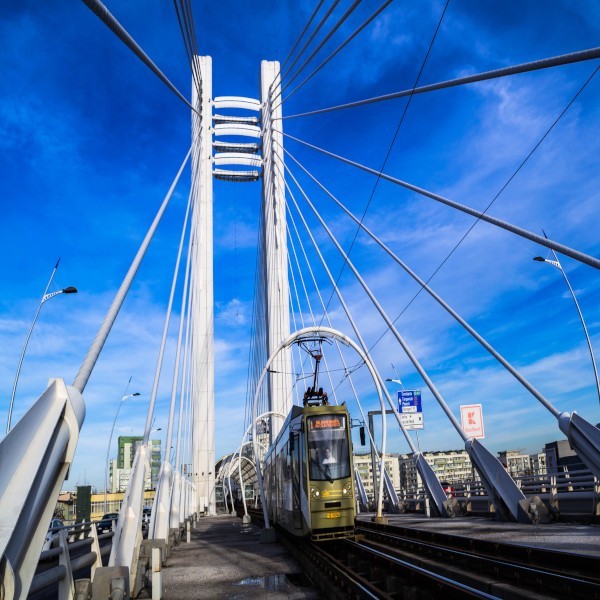 A tram traveling over a bridge on the Main Page Template.
